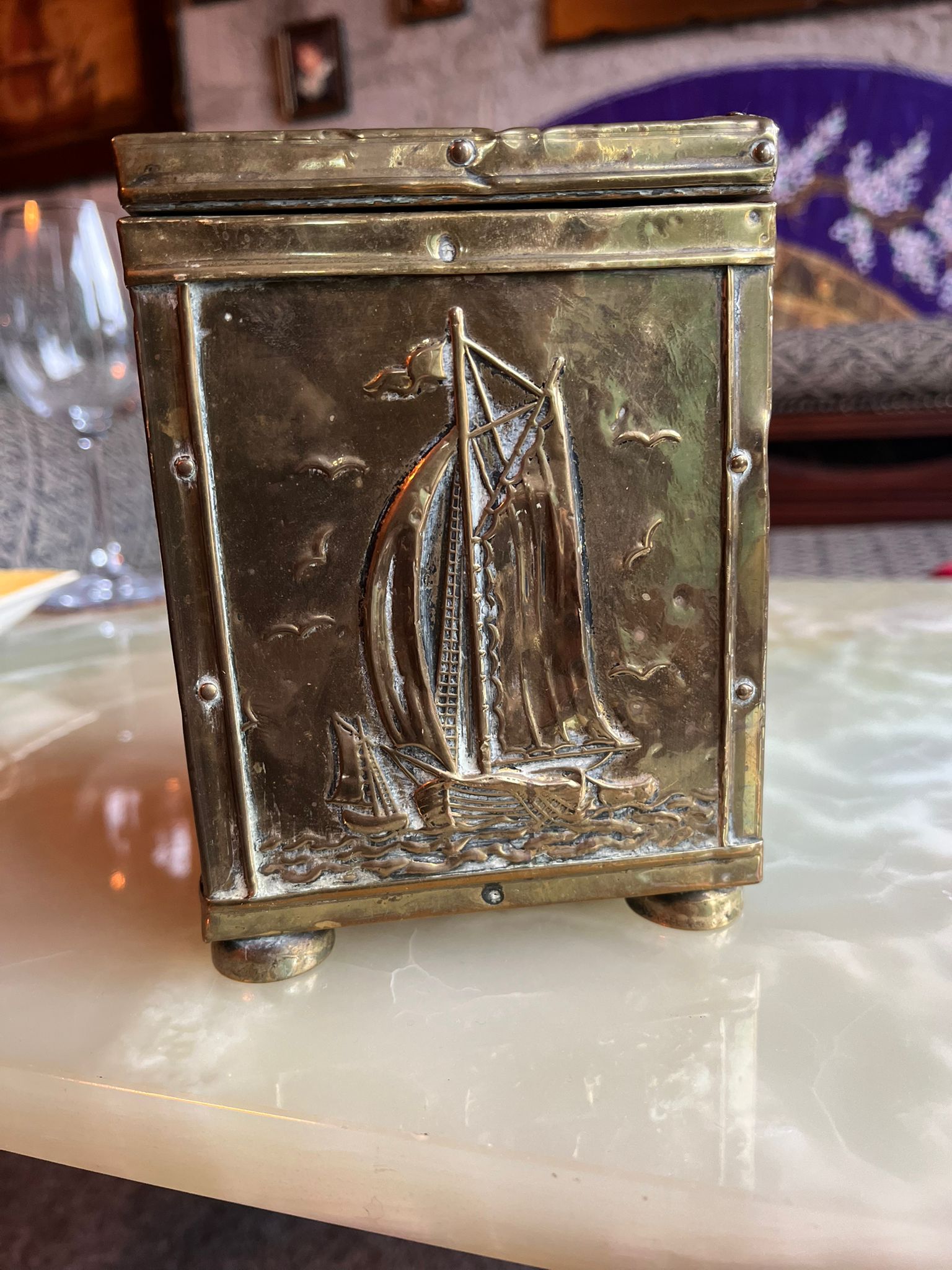 Antique brass tea box with sailing ship relief