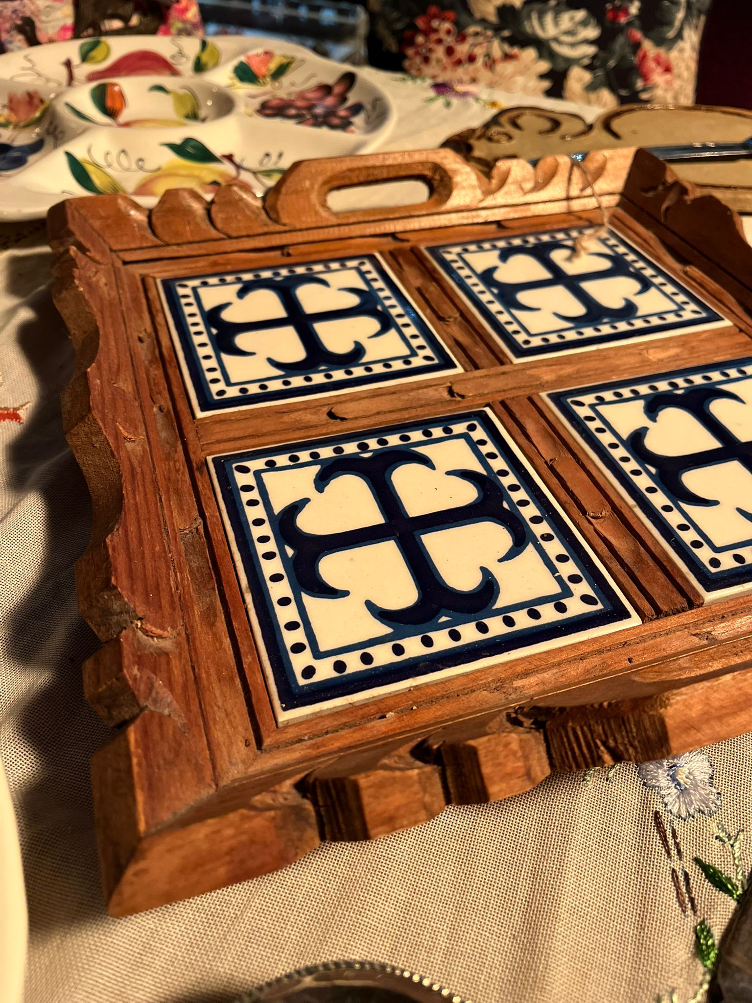 Vintage wooden serving tray with blue and white ceramic tiles