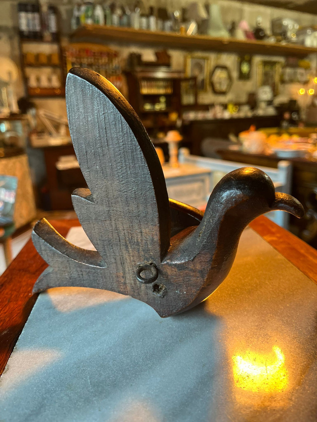 Antique hand-carved wooden bird statue
