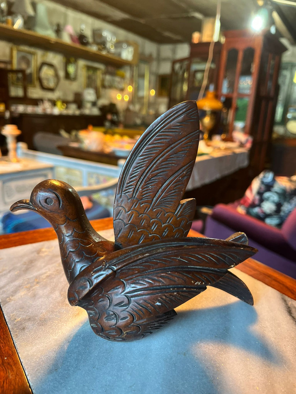 Antique hand-carved wooden bird statue