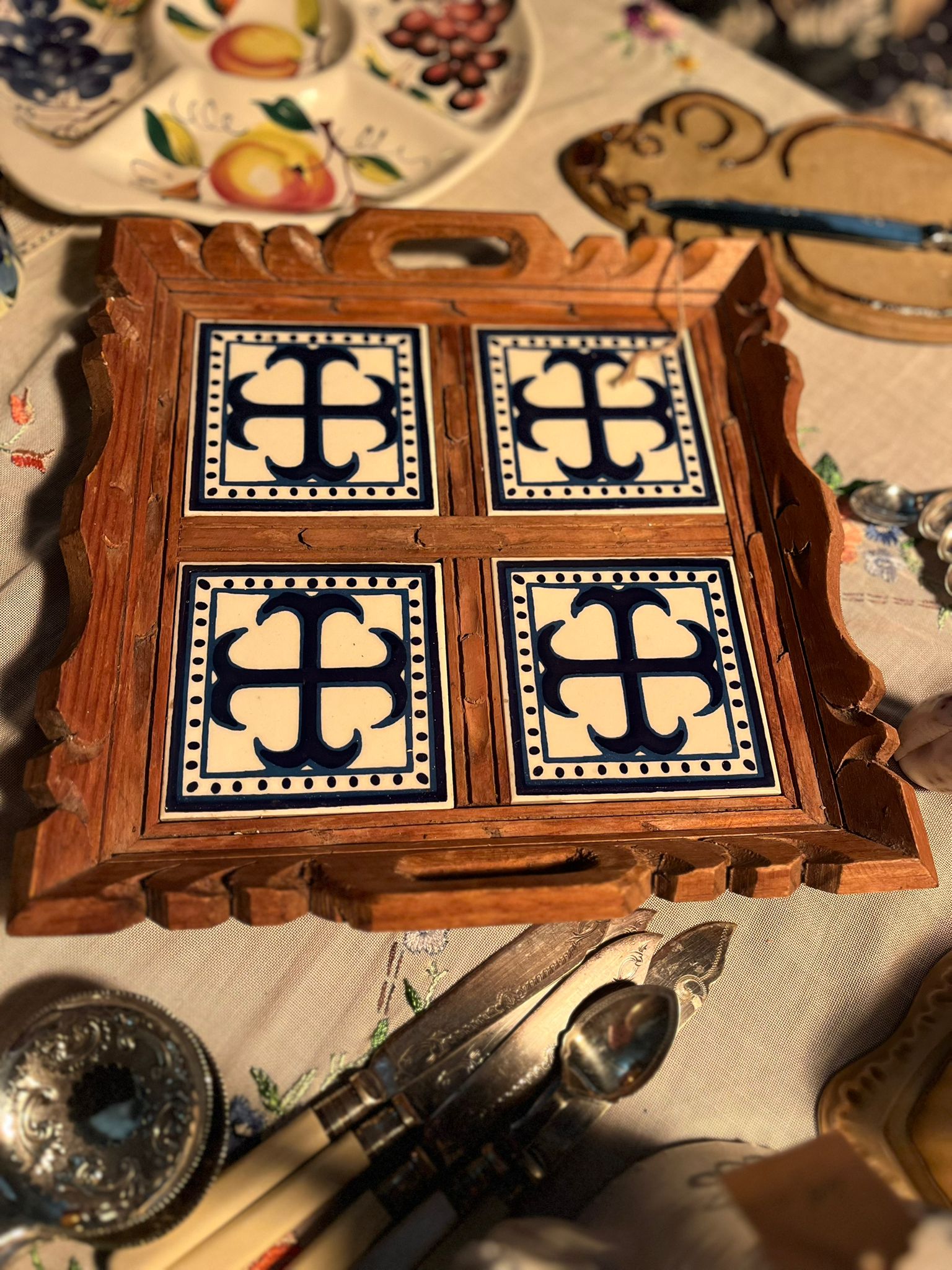Vintage wooden serving tray with blue and white ceramic tiles
