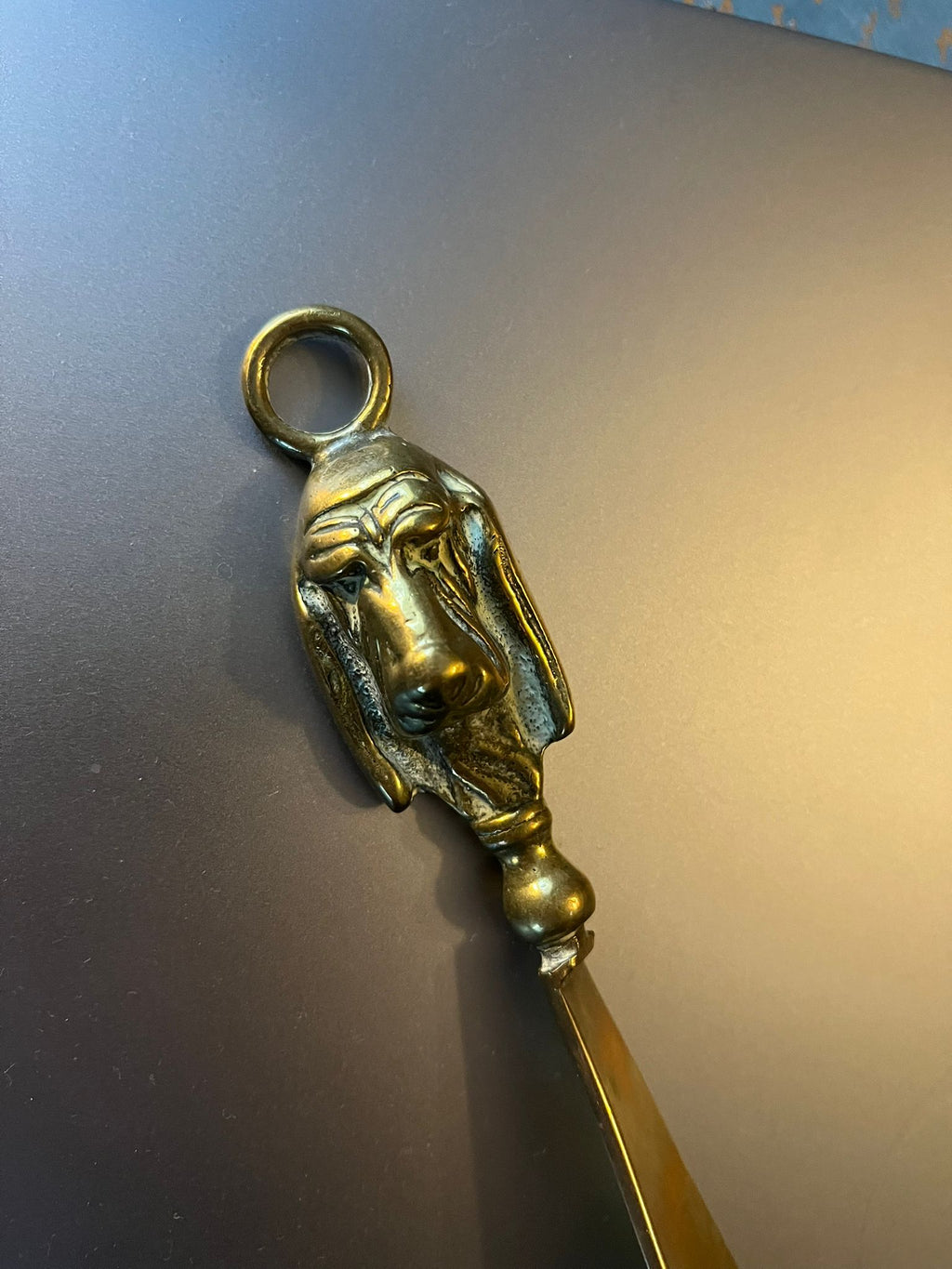 Vintage brass shoehorn with dog head handle