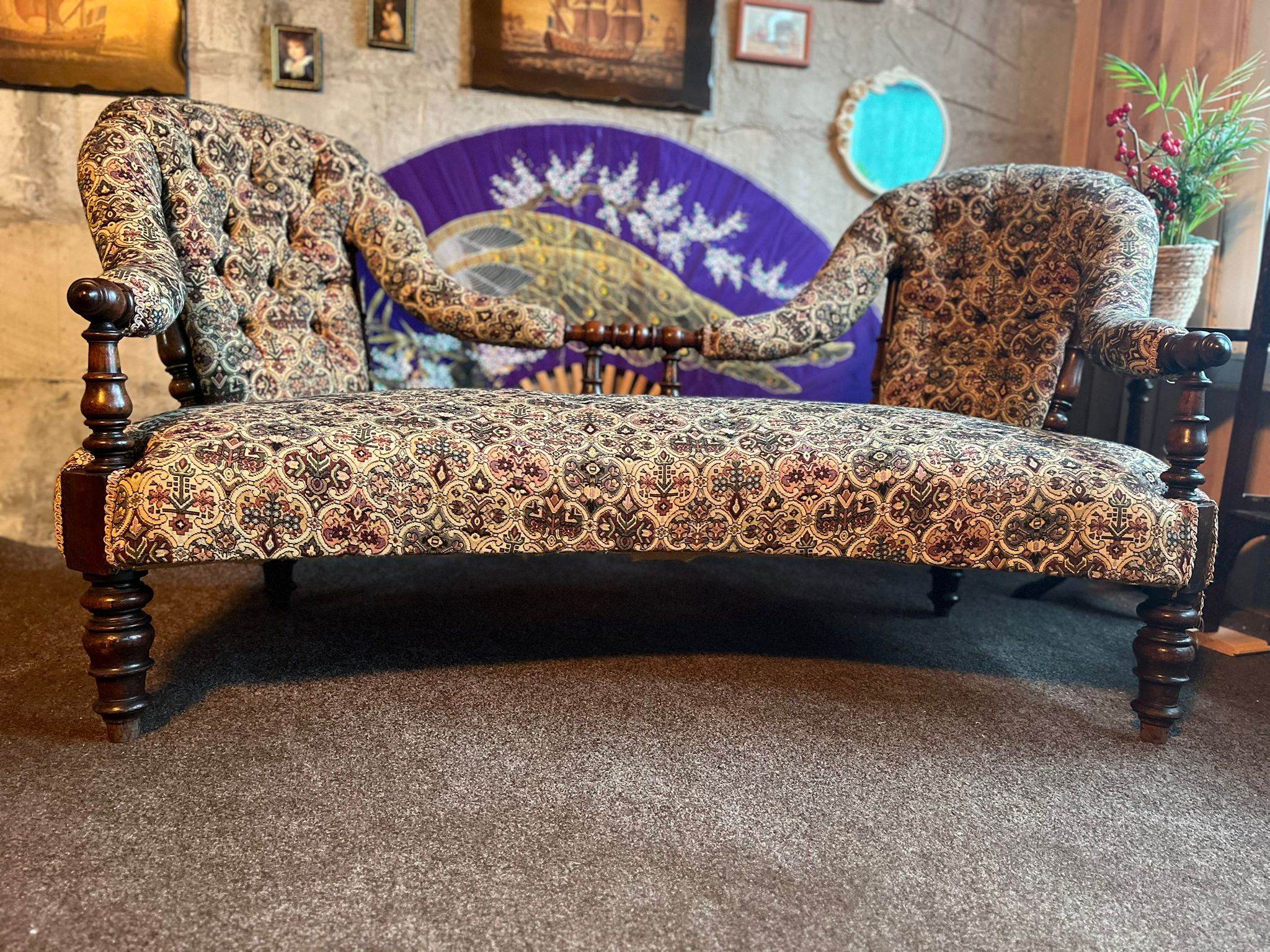 Antique Victorian two-seater “conversation sofa”