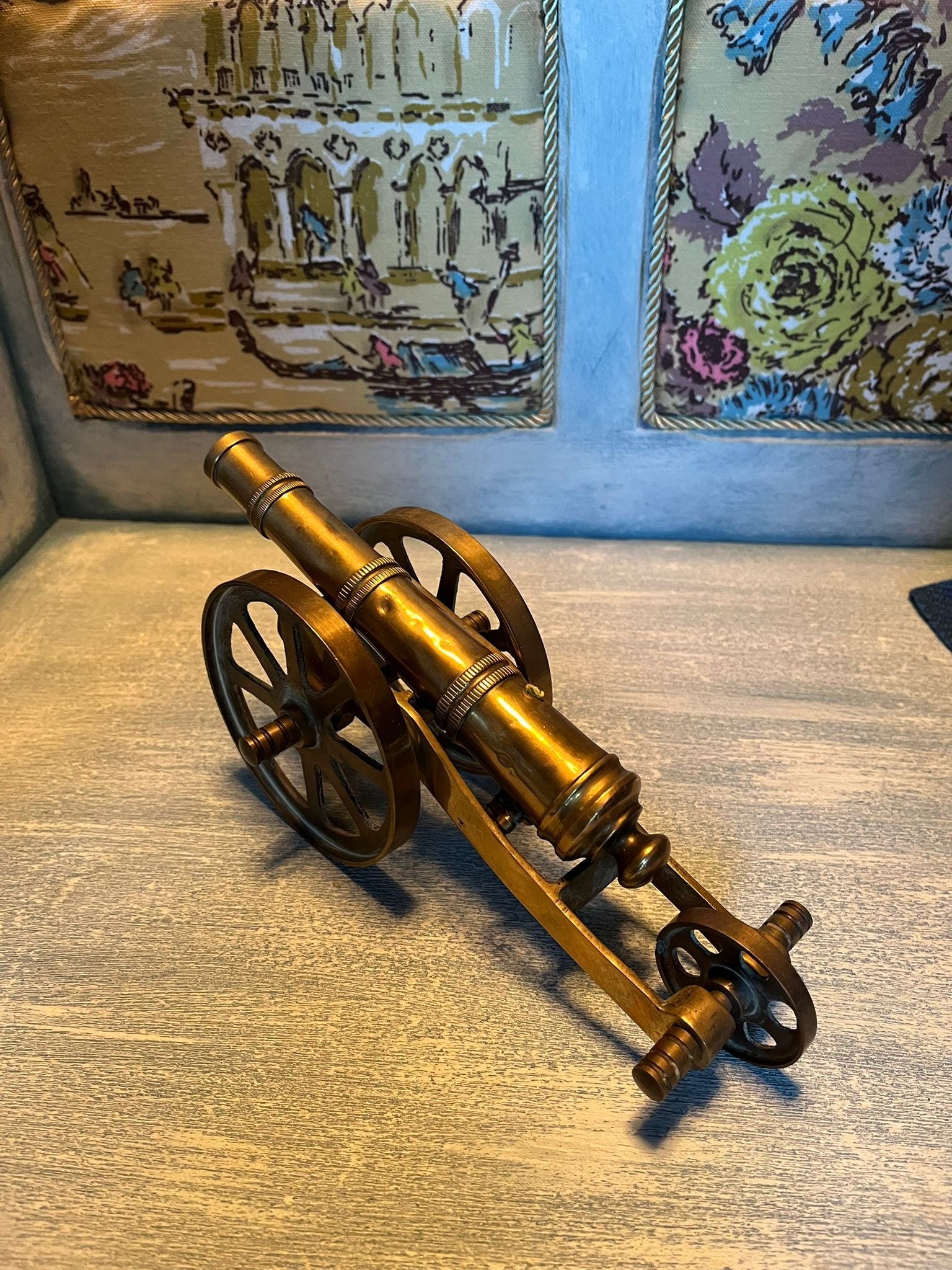 Old brass cannon model – a nautical and military-themed interior design element