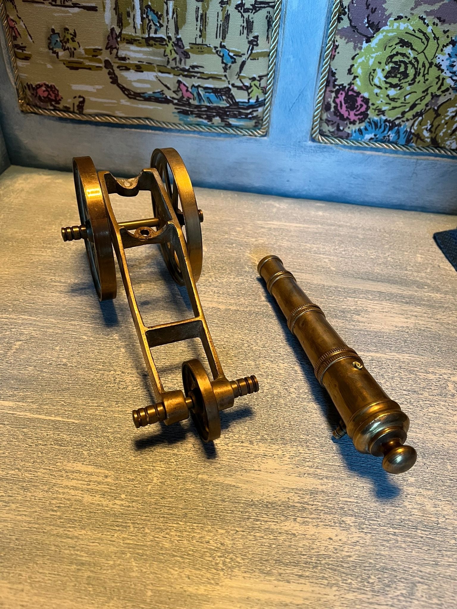 Old brass cannon model – a nautical and military-themed interior design element