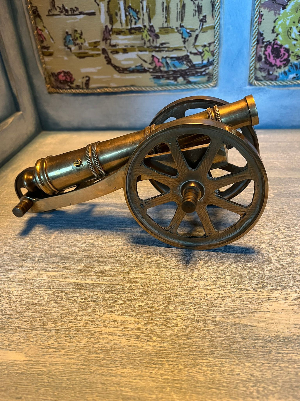 Old brass cannon model – a nautical and military-themed interior design element