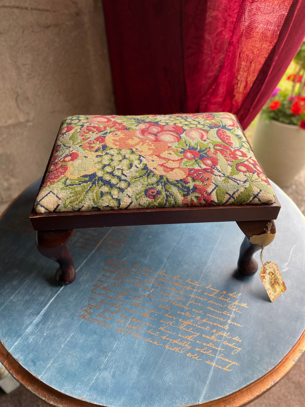 Vintage footstool with floral embroidery cover