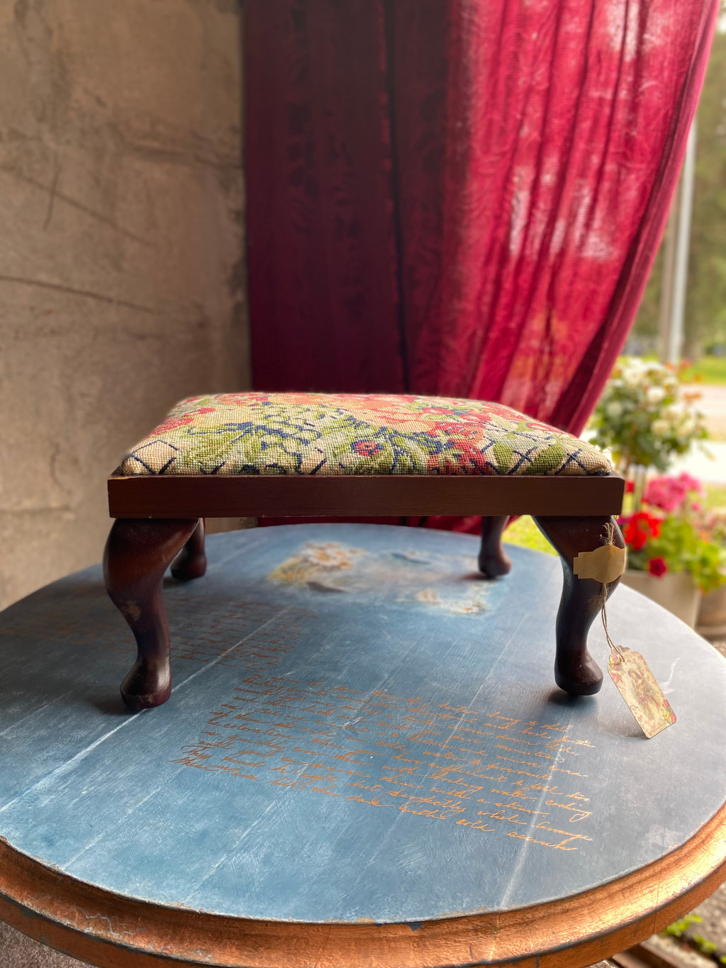 Vintage footstool with floral embroidery cover