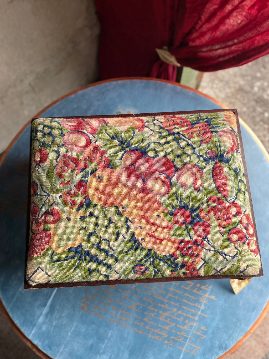 Vintage footstool with floral embroidery cover