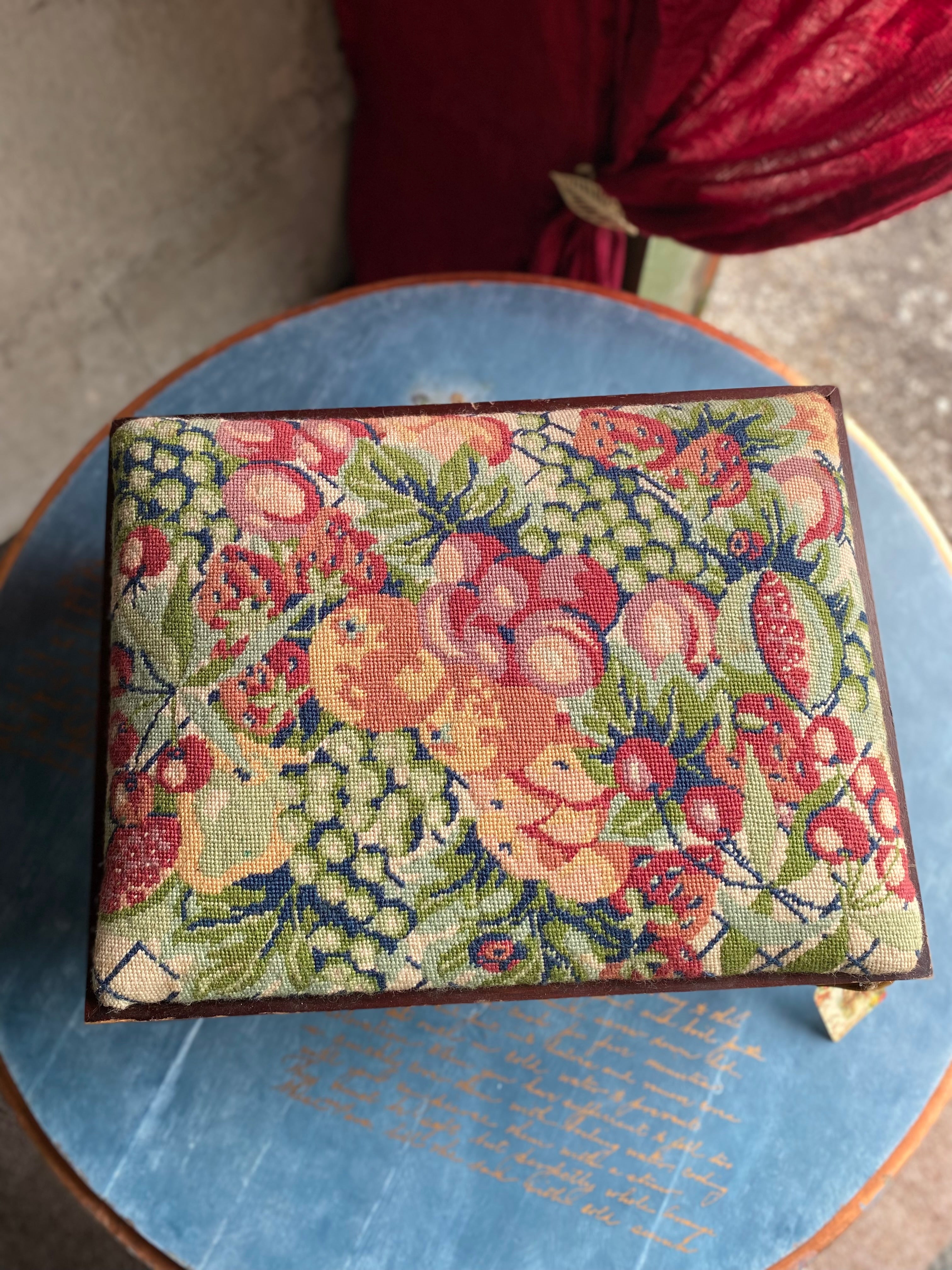 Vintage footstool with floral embroidery cover