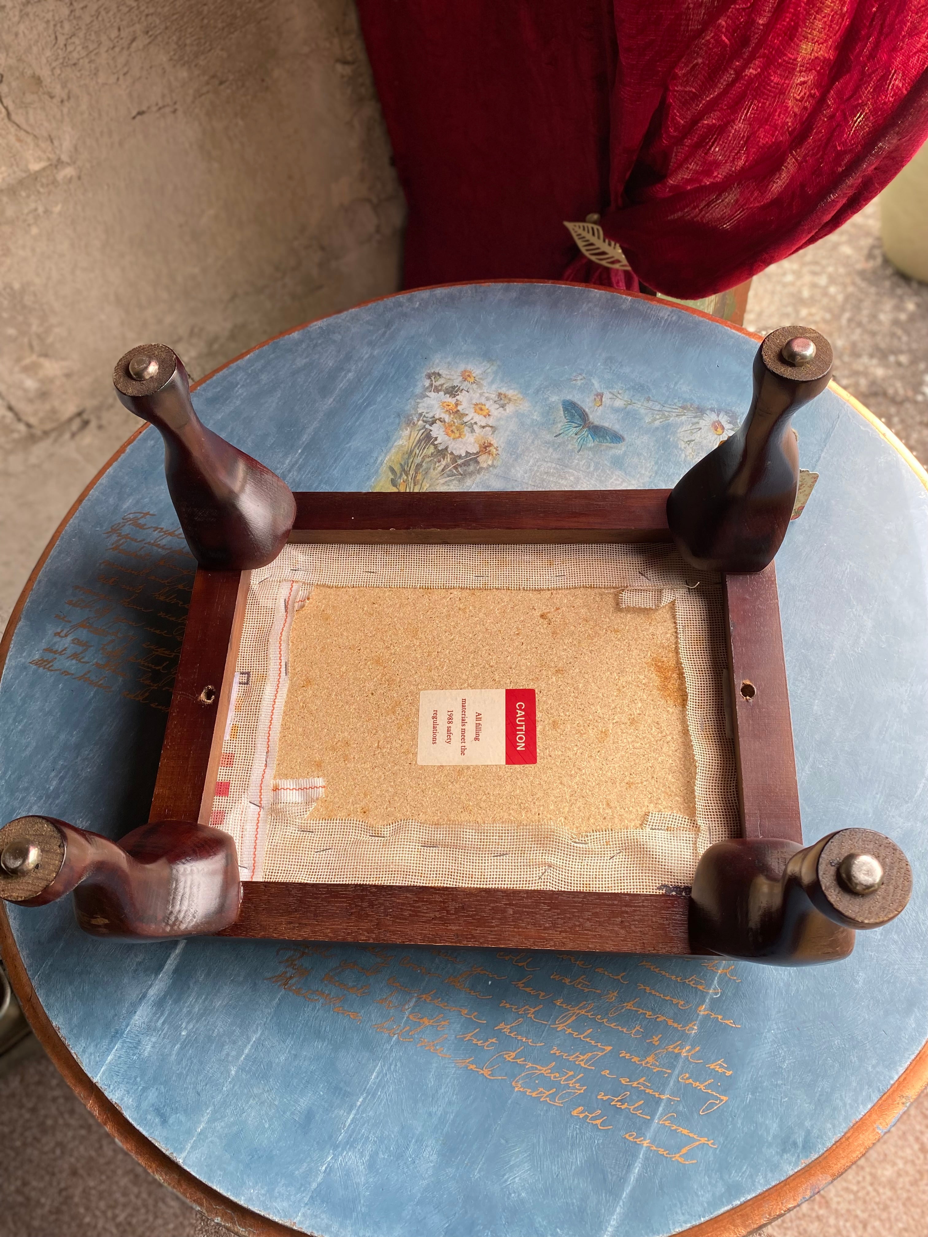 Vintage footstool with floral embroidery cover