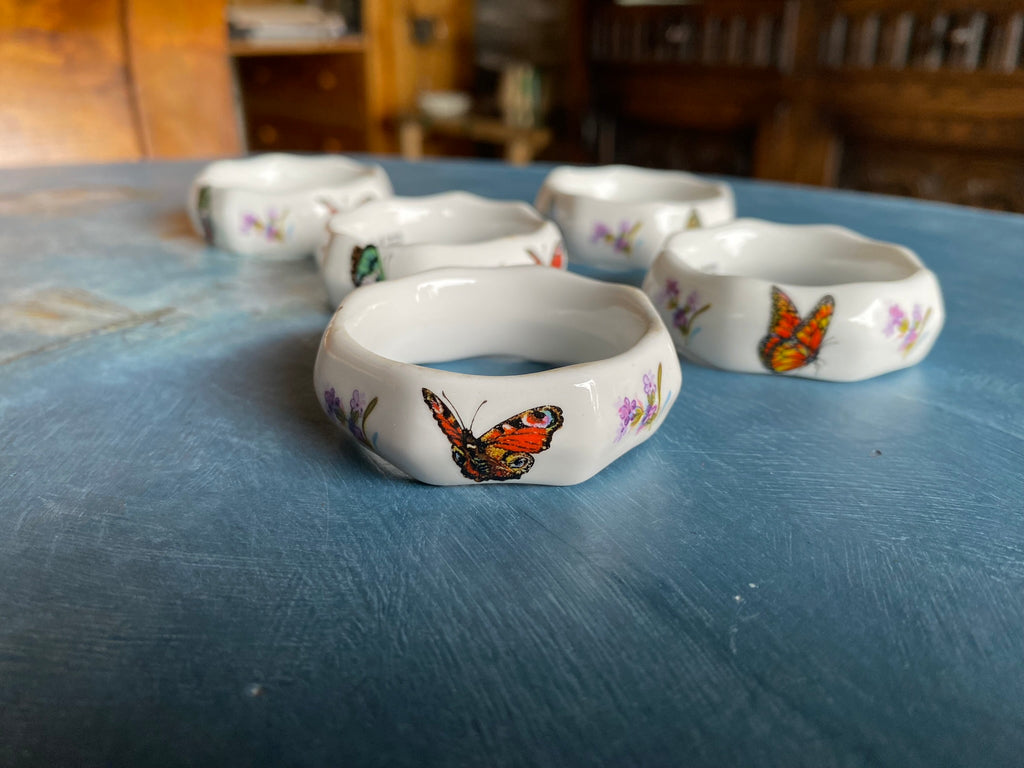 Vintage porcelain napkin ring set with butterflies