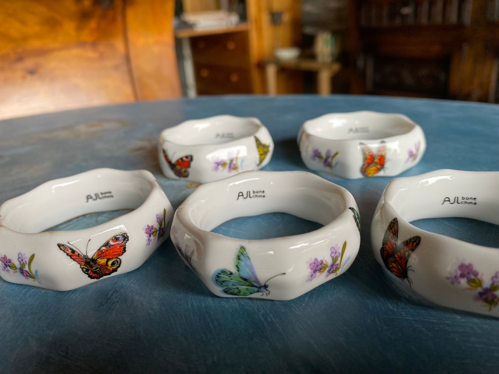 Vintage porcelain napkin ring set with butterflies