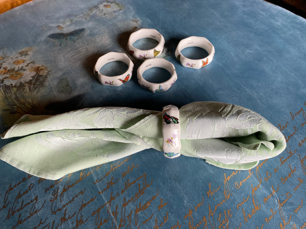 Vintage porcelain napkin ring set with butterflies