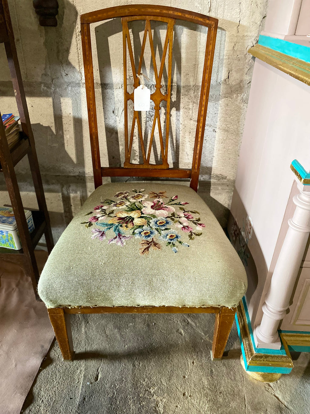 Vintage embroidered chair with brass wheels