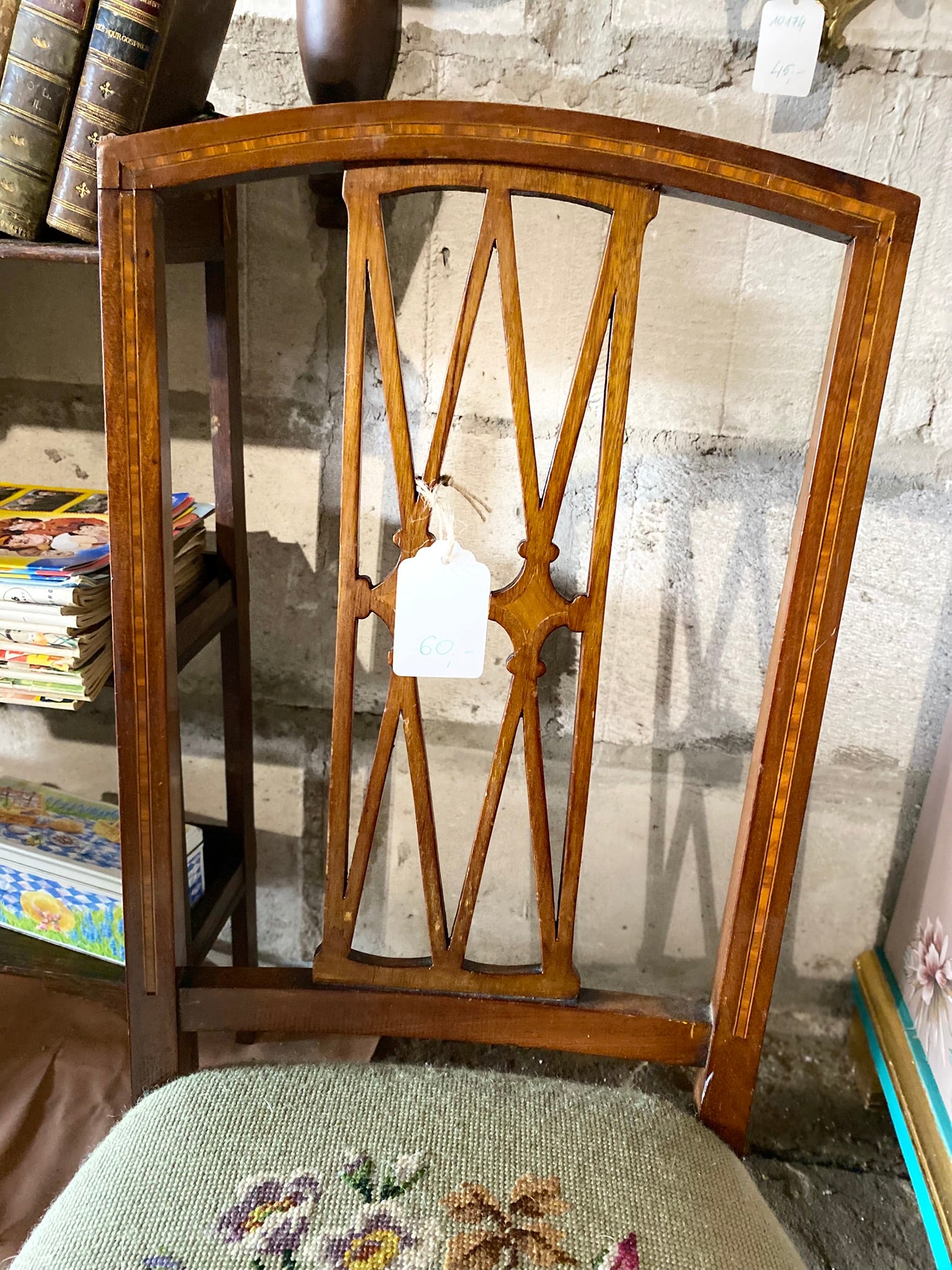 Vintage embroidered chair with brass wheels