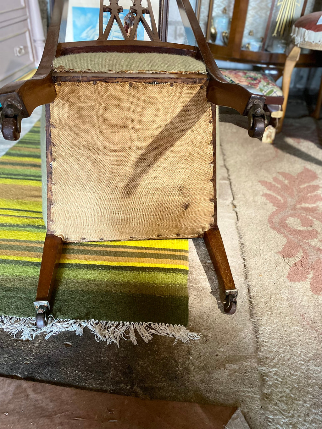 Vintage embroidered chair with brass wheels
