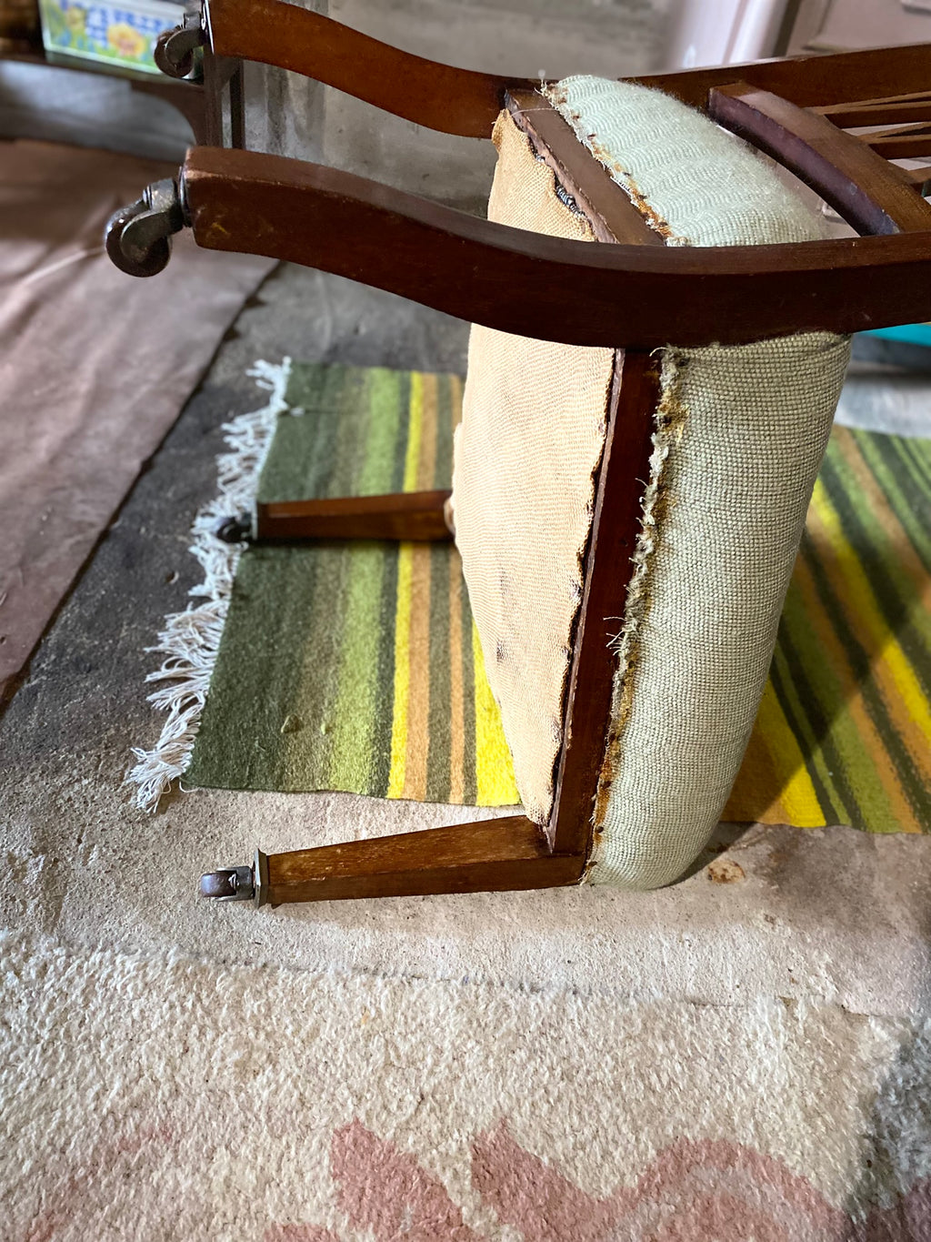 Vintage embroidered chair with brass wheels