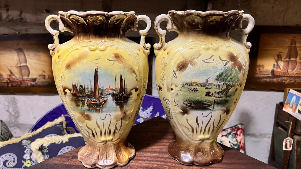 Pair of antique hand-painted ceramic vases with landscape views
