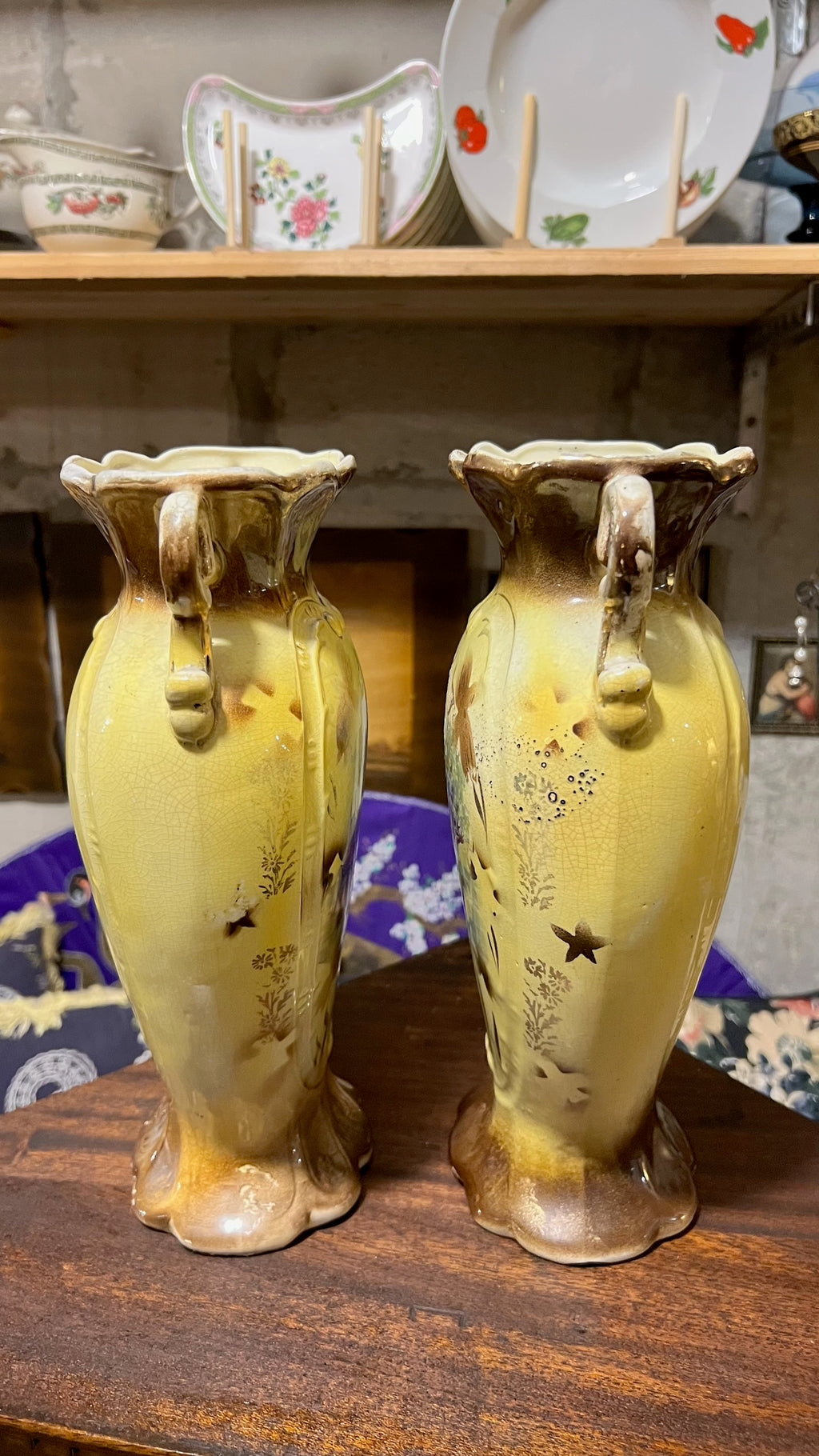 Pair of antique hand-painted ceramic vases with landscape views