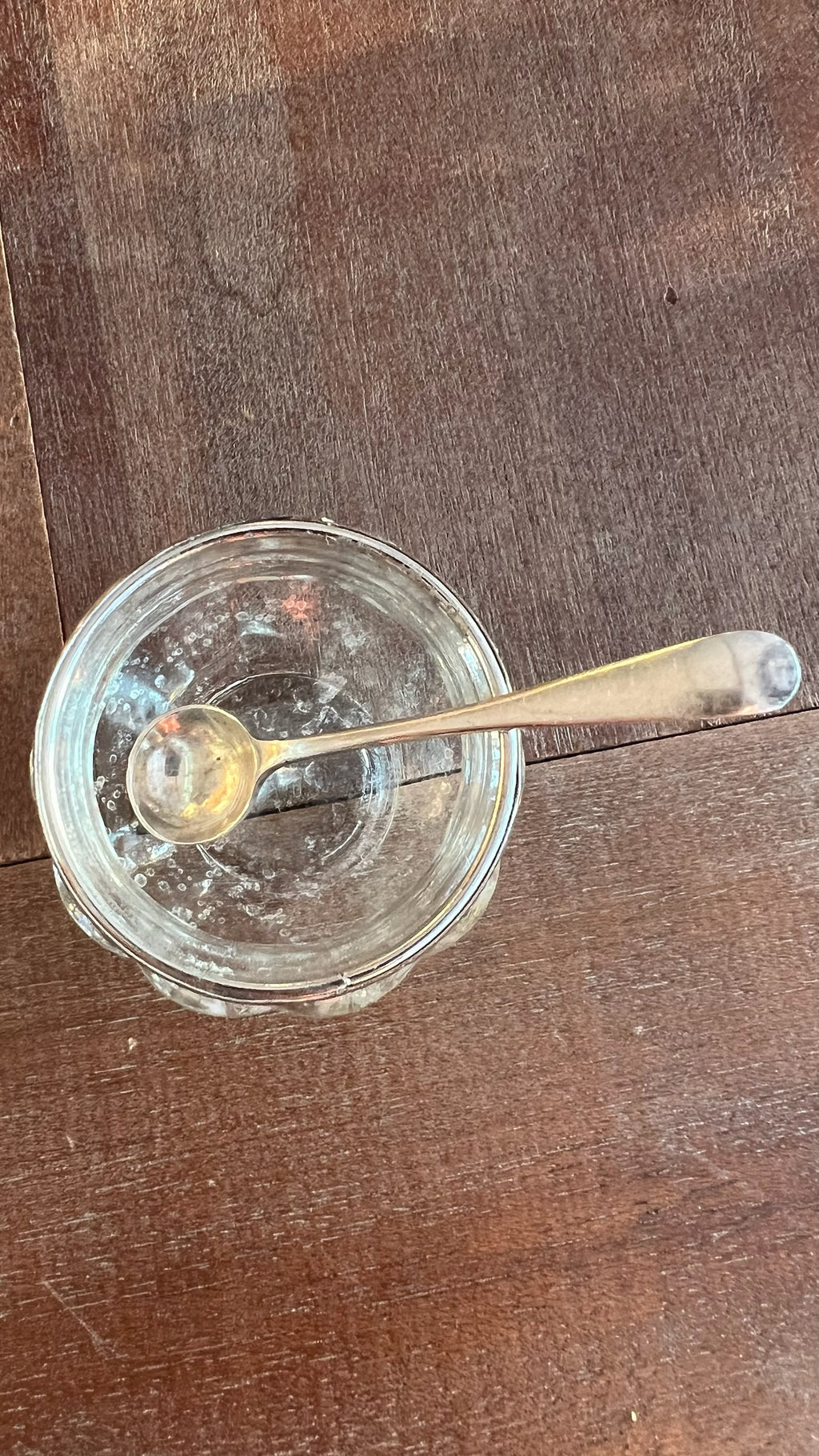 Antique English glass salt shaker with sterling silver spoon