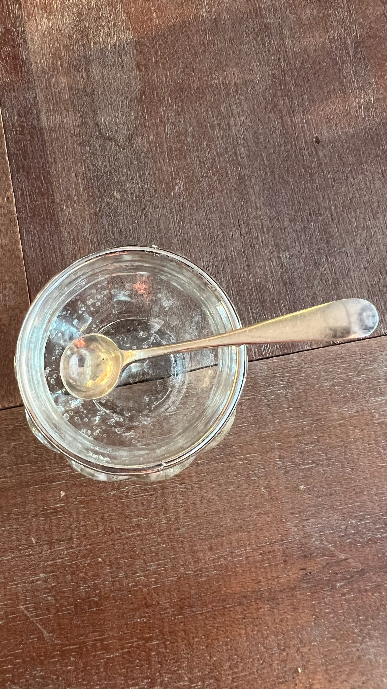 Antique English glass salt shaker with sterling silver spoon