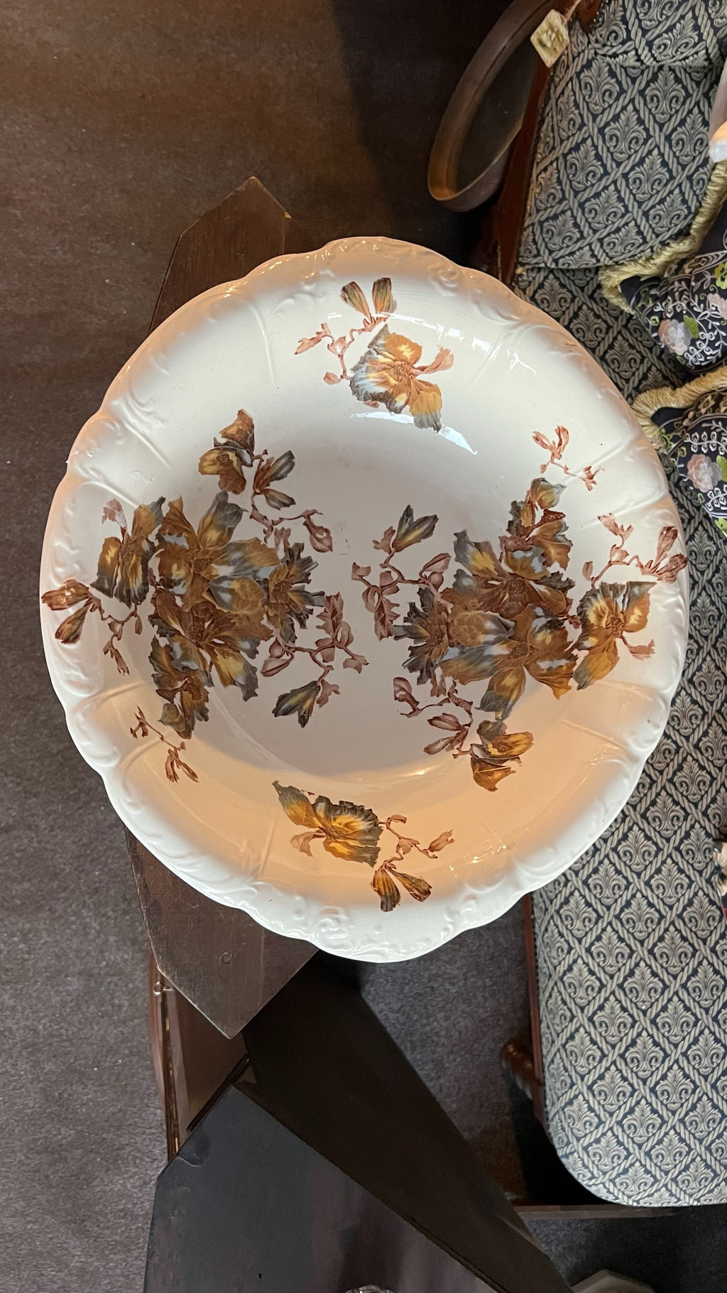 Antique porcelain bowl with brown floral decoration