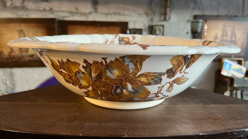 Antique porcelain bowl with brown floral decoration