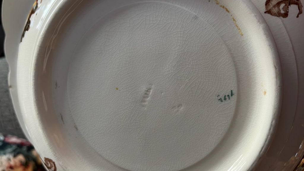 Antique porcelain bowl with brown floral decoration