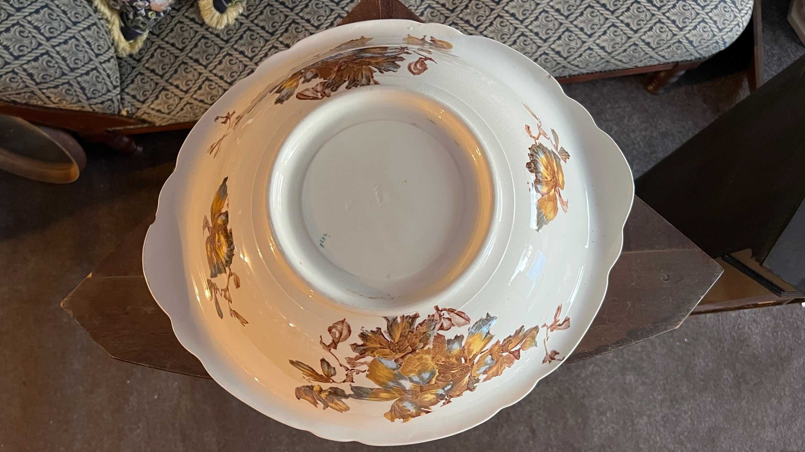 Antique porcelain bowl with brown floral decoration