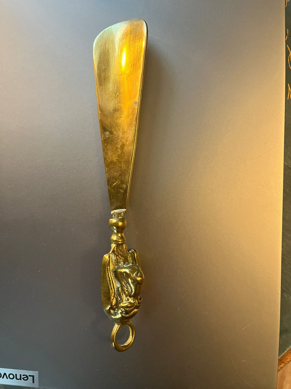 Vintage brass shoehorn with dog head handle